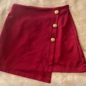 Medium button front skirt asymmetrical flap. Maroon color, from Shien